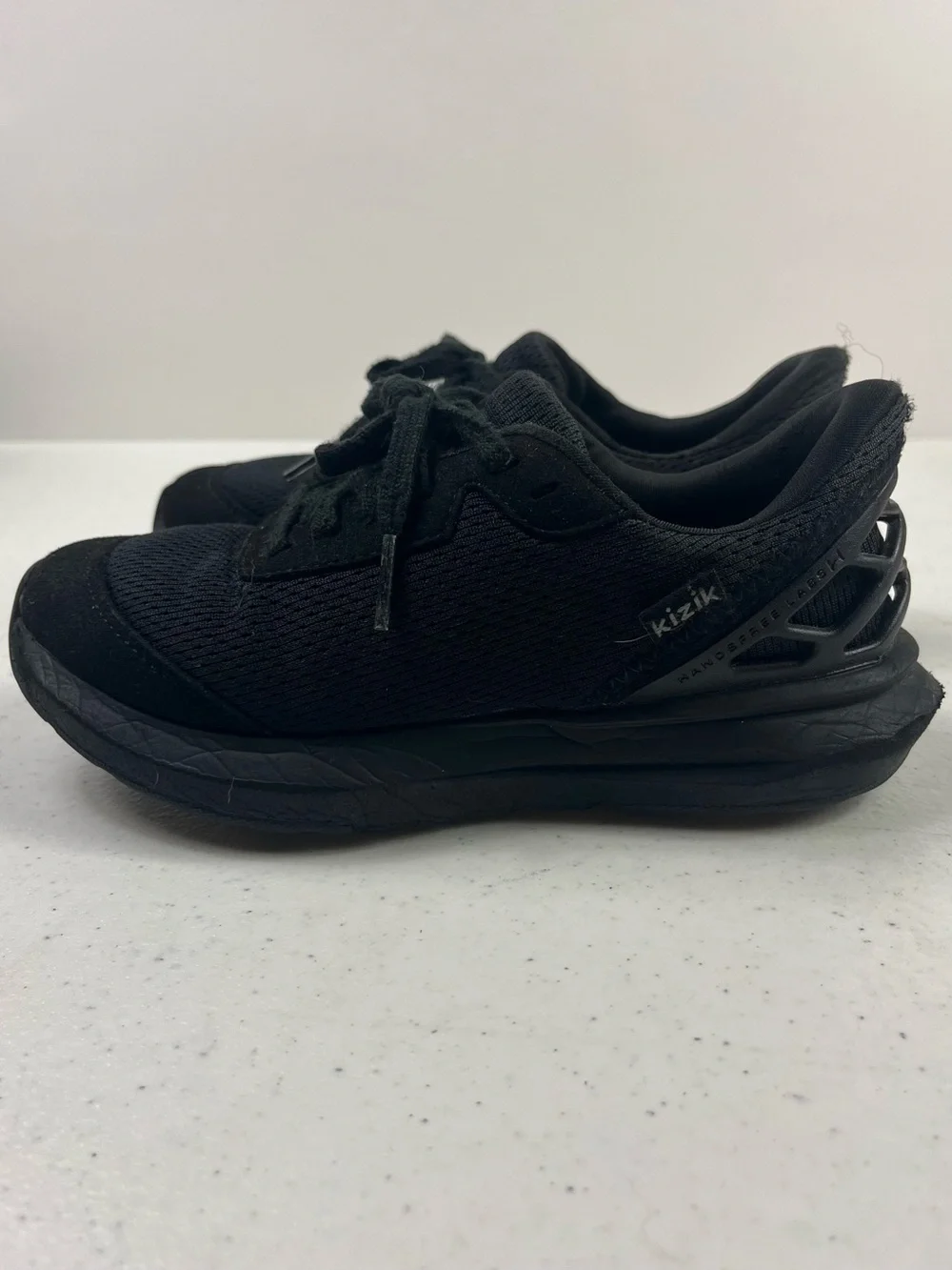 Kizik Kids All-Black Slip-On Athletic Shoe